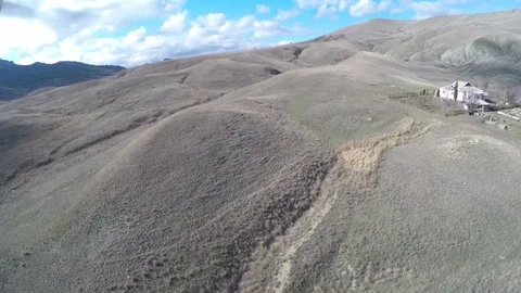 Flight of a drone over the valley in the mountains in the autumn on a sunny day Stock Footage 86564916