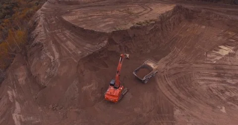 Flight to drone on sand quarry with heavy machinery Stock Footage 71282161