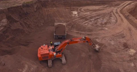 Flight to drone on sand quarry with heavy machinery Stock Footage 71282524