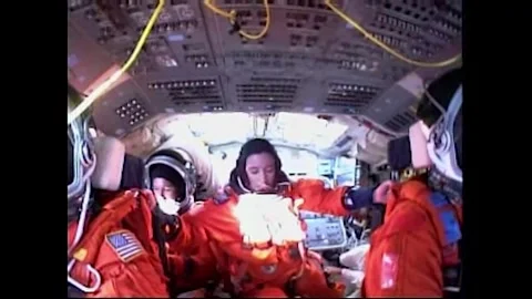 Flight Engineer Megan McArthur taking her seat aboard Space Shuttle Atlantis Stock Footage 283460438