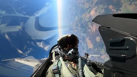 In-flight footage of U.S.A.F. pilot banking hard left in F-16 Fighting Falcon Stock-Footage 229698600