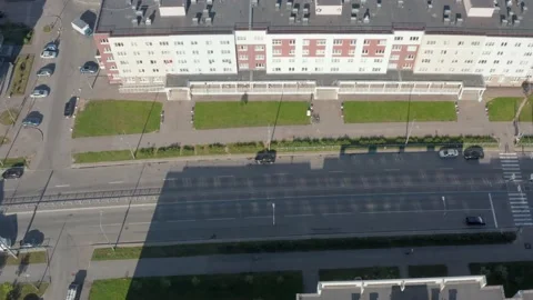 Flight forward over roofs and roads in the modern residential green district Stock Footage 203880691