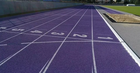 Flight forward over rubber sport track Stock Footage 80238796