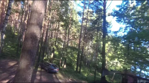 Flight on a fpv drone in the forest through a camp Stock Footage 208629710