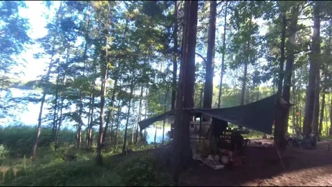 Flight on a fpv drone in the forest through a camp Stock Footage 208629714