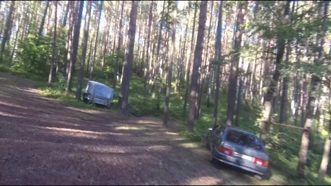 Flight on a fpv drone in the forest through a camp Stock Footage 208629933