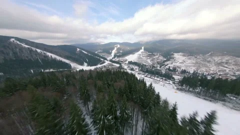 Flight of the FPV drone over a ski resort in the Korpatski mountains Stock Footage 167428575