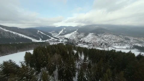 Flight of the FPV drone over a ski resort in the Korpatski mountains Stock Footage 167428664