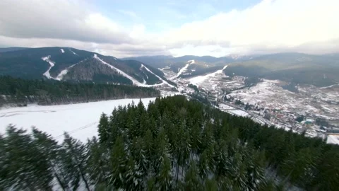Flight of the FPV drone over a ski resort in the Korpatski mountains Stock Footage 167428703