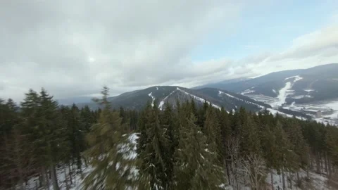 Flight of the FPV drone over a ski resort in the Korpatski mountains Stock Footage 167428789