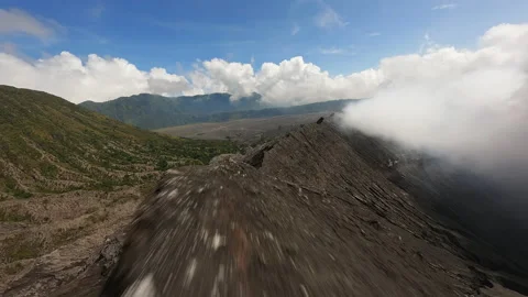 Flight Fpv drone in the vent of a steaming volcano Stock Footage 238363109