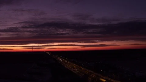 Flight in front of cloudy sunrise above road 2 Vídeo Stock 123768845