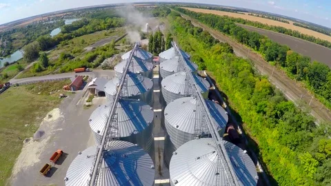 Flight of the grain terminal from the drone. The grain plant for storage and dry Stock Footage 104167007