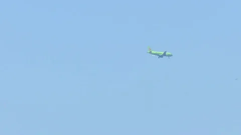 Flight of a Green Large Passenger Plane Stock Footage 81114903