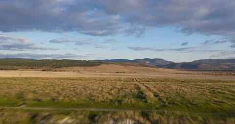 Flight in green mountain meadow.  Stock Footage 106663623