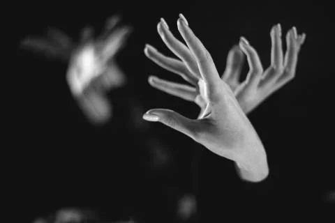 Flight of hands, darkness Foto stock