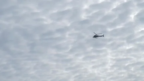 Flight of the helicopter,on sky background, slow motion video Stock Footage 96307590