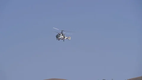 Flight of the helicopter with two screws. Movement through the air machines for Stock Footage 120471799