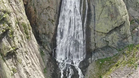 Flight to a high-altitude waterfall. The stream flows from the glacier. Big Stock Footage 269296986