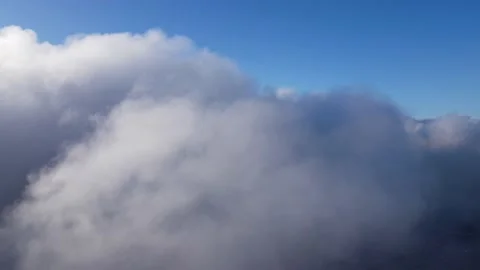 Flight high in the fluffy clouds plane pilot POV Stock Footage 142938728