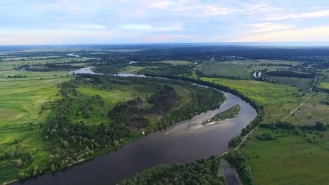 Flight high over a narrow river. Aerial. Video stock 79927011