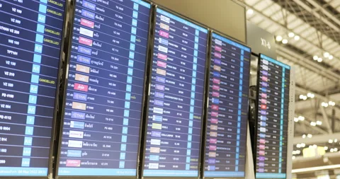 Flight information at a timetable at  airport . Stock Footage 192784971