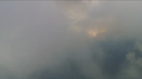 Flight inside Aerial Clouds, light in distance Stock Footage 34512365