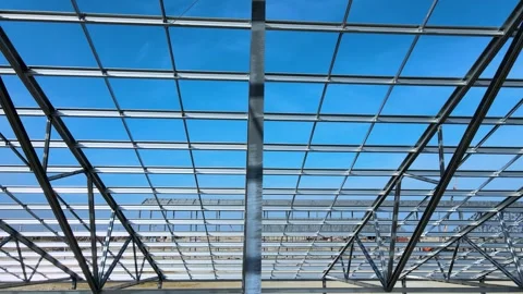 Flight inside the construction of a large metal structure in agricultural area Stock Footage 306300554