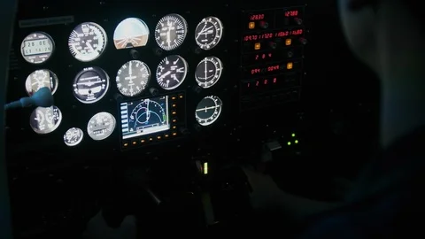 Flight instructor explaining and pointing at each display Stock Footage 99138715