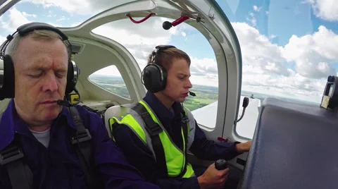 Flight Instructor Teaching Student in Air Stock Footage