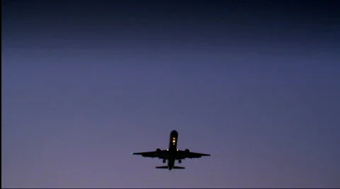Flight of a jet plane - evening time 3 Stock Footage 729499