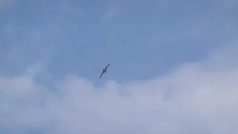 Flight of a jet plane in the sky in the clouds Stock Footage 284315579