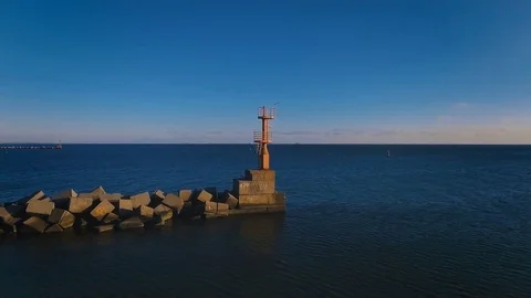 The flight to the lonely lighthouse in the ocean . Leading beacons. 4K. Stock Footage 71019803