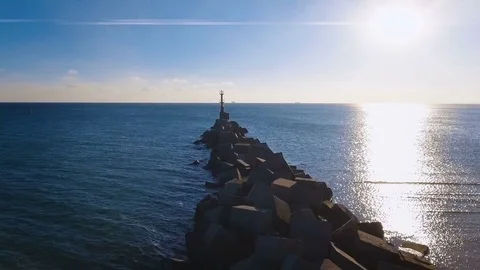 The flight to the lonely lighthouse in the ocean . Leading beacons. 4K. Video stock 71020174