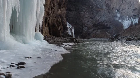 Flight low over the water of a mountain river in a narrow gorge Stock Footage 85684759