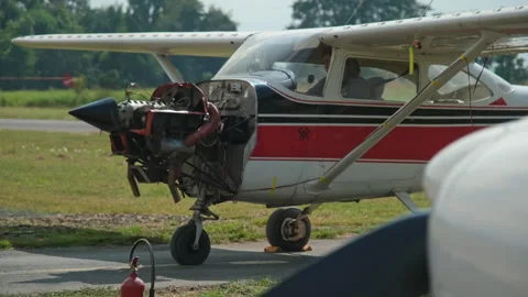 Flight mechanics is inspecting a small airplane before flight. Stock Footage 258001107