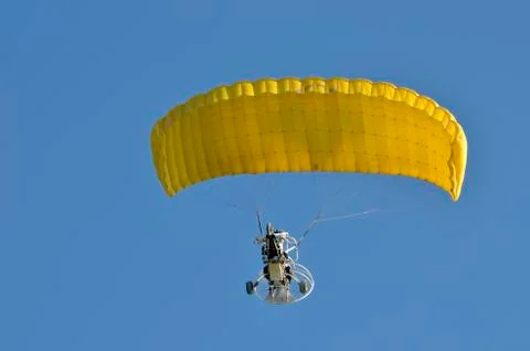 Flight of a motor paraplan Stock Photos