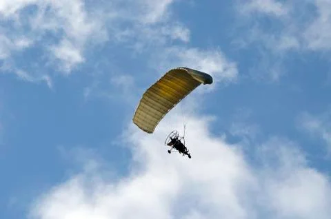 Flight of a motor paraplan Stock Photos