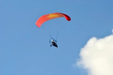 Flight of a motor paraplan Stock Photos