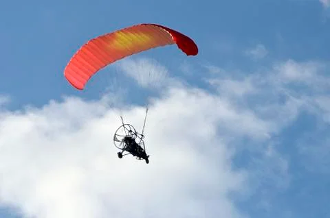 Flight of a motor paraplan Stock Photos