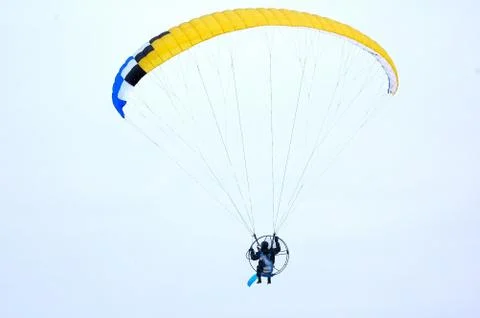 Flight on a motorized paraglider 写真素材