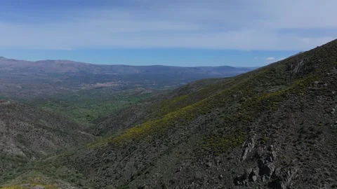 Flight on mountain peaks with a valley in the background 스톡 동영상 277204707