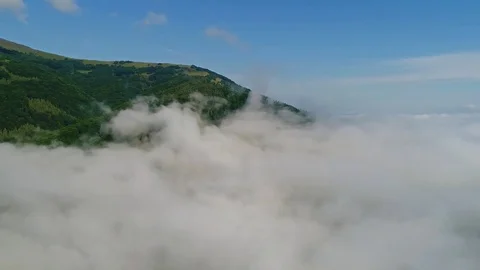 Flight in mountains like bird through clouds. Stock Footage 83761752