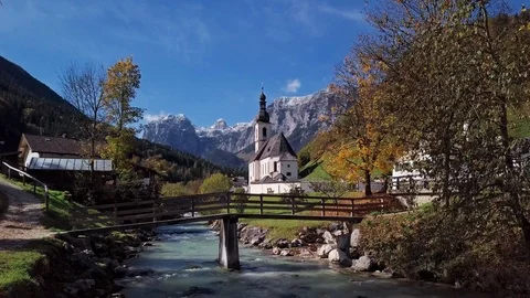 Flight near church in Ramsau, Berchtesgaden, Germany Stock Footage