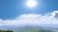 The flight near four people on a mountain against a bright sun 4k or 4k+ Resolution