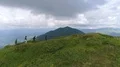 The flight near four people walking up the mountain 4k or 4k+ Resolution