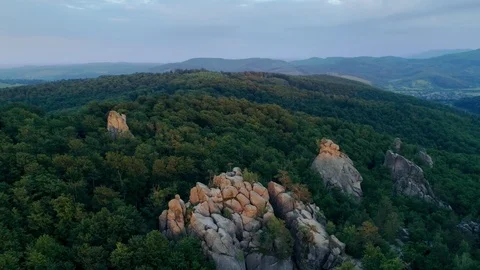 Flight near High cliffs surrounded by dense forest. A nature wonder Trees Stock Footage 94744942