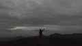 The flight near the man with a firework stick on the mountain 4k or 4k+ Resolution