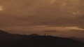 The flight near the man with a firework stick on a mountain 4k or 4k+ Resolution