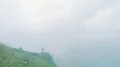 The flight near a man standing on a mountain on the foggy background 4k or 4k+ Resolution